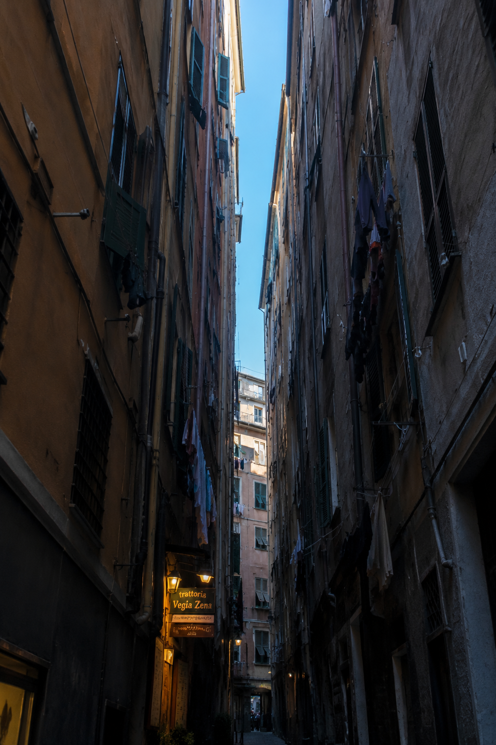 The narrow caruggi alleyways with a sliver of sky above